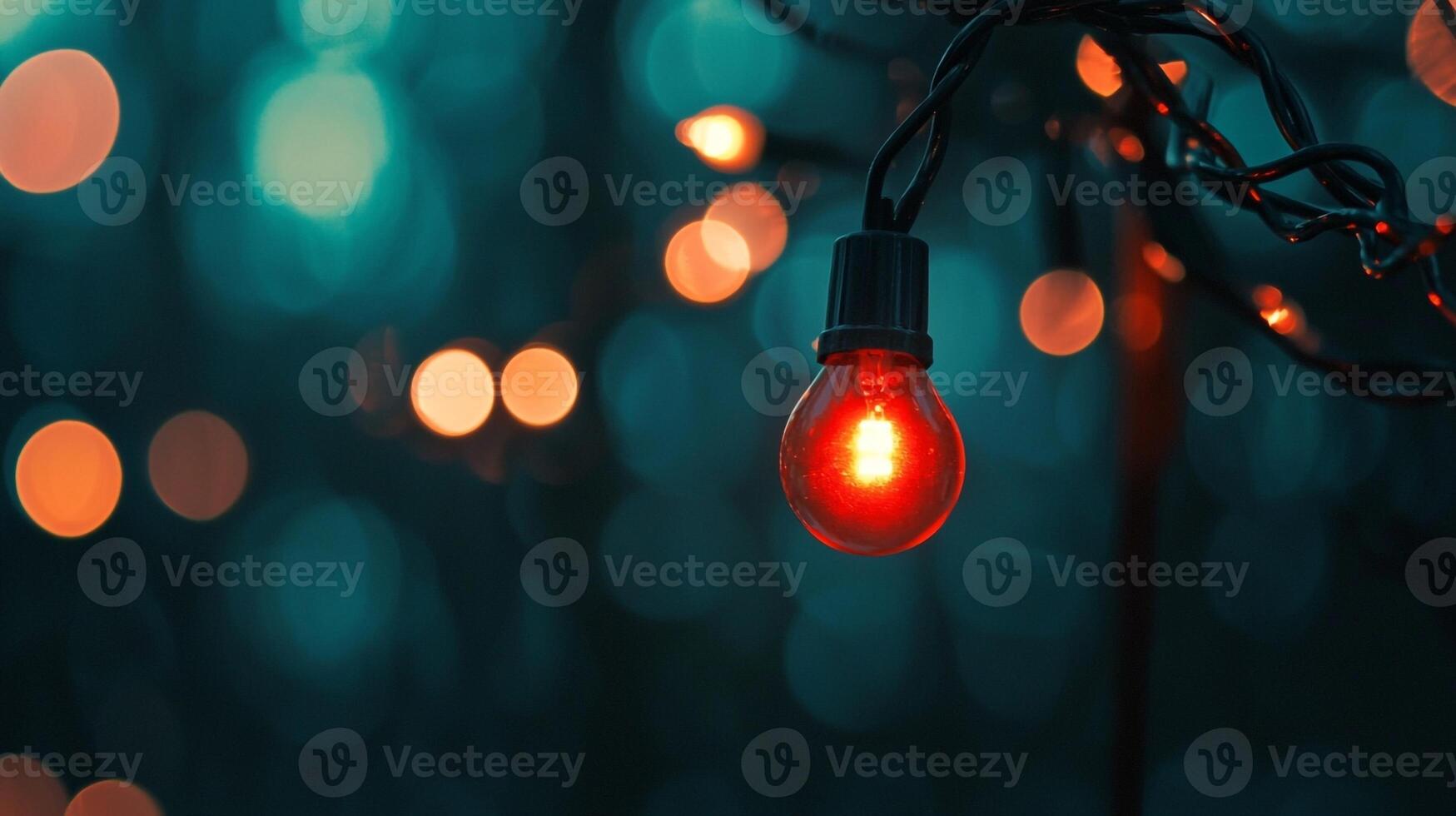 A red light is shining on a string of lights photo