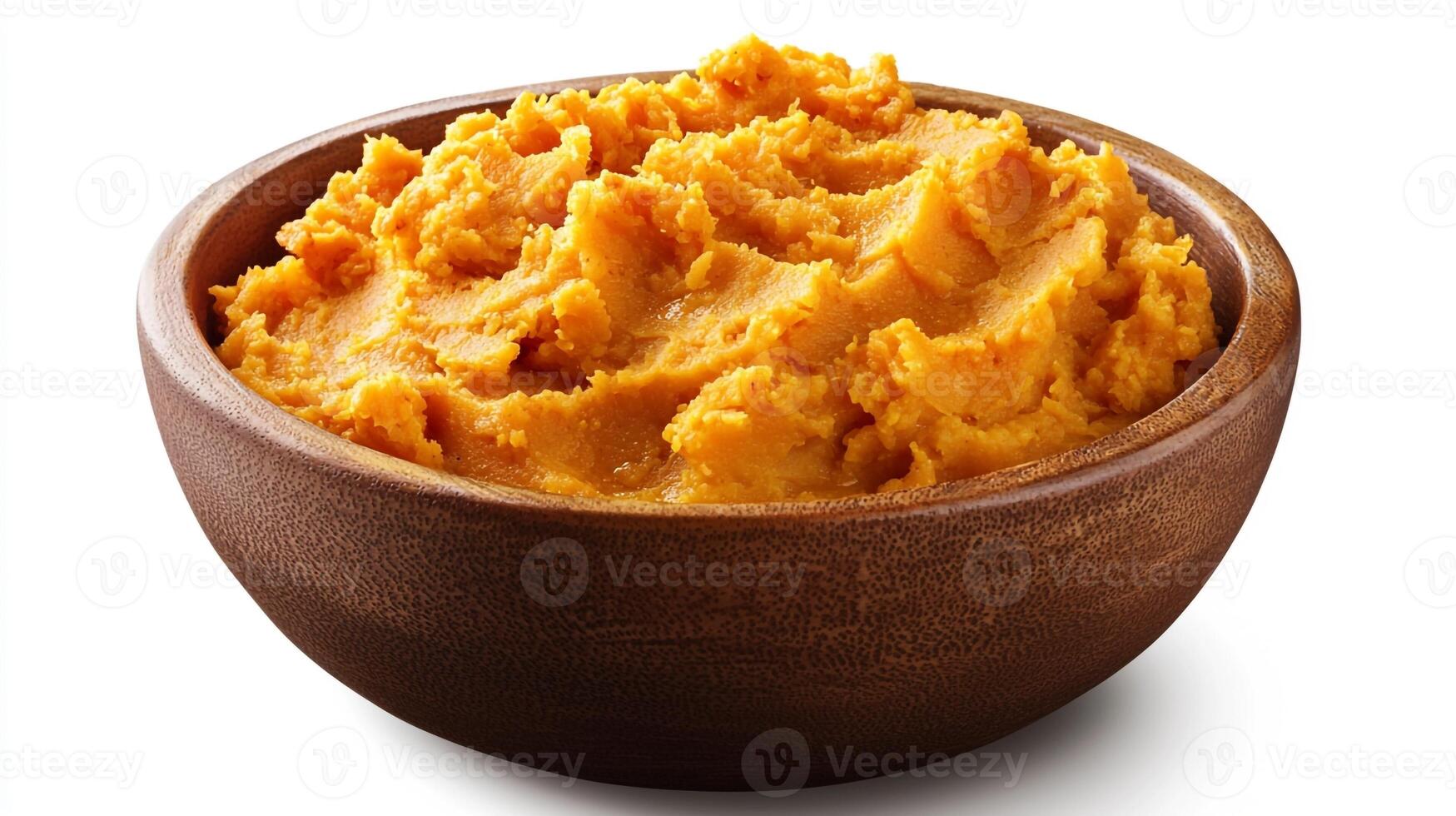 A bowl of mashed sweet potato on a white background photo