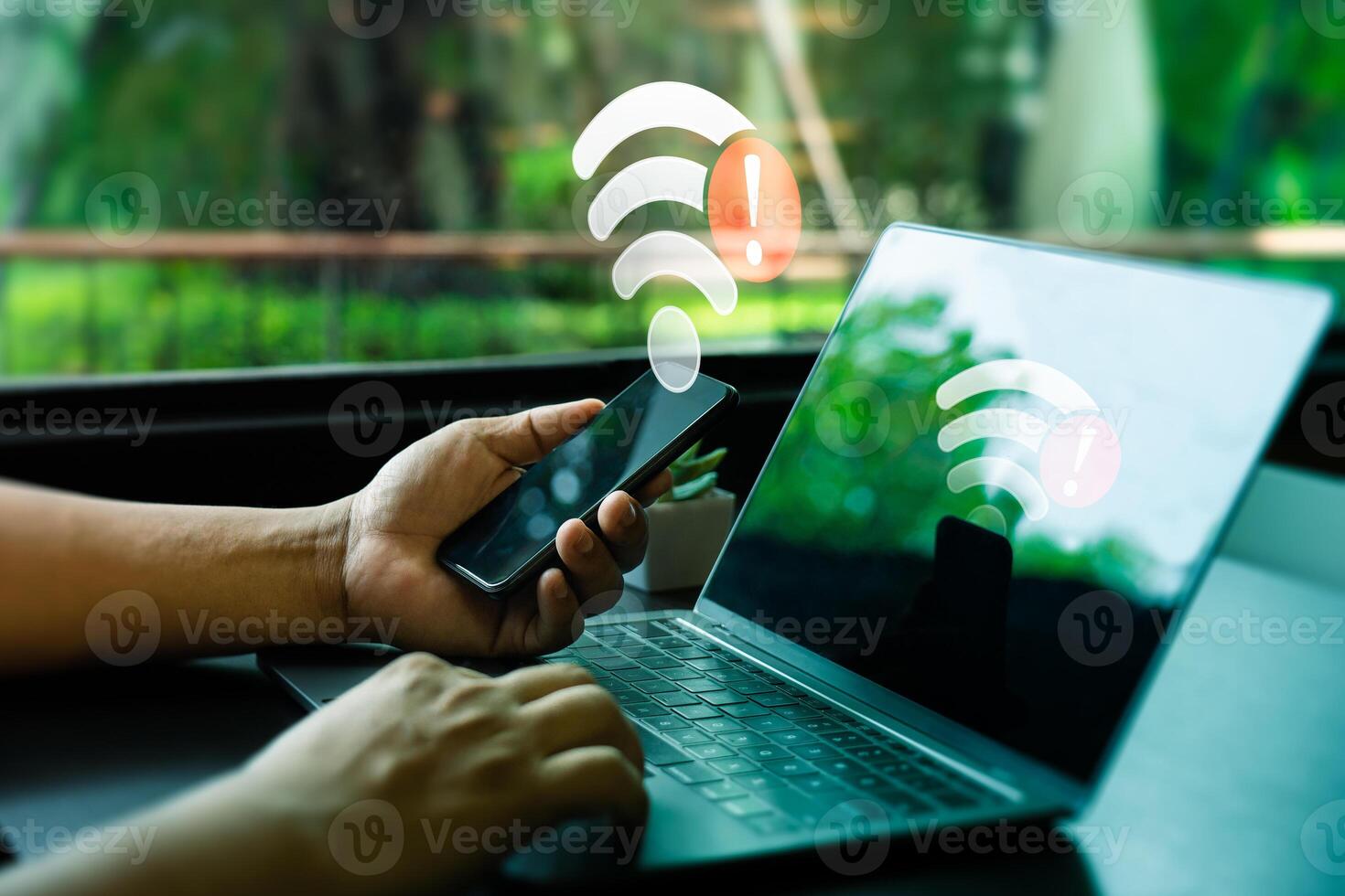 Person Holding Smartphone and Laptop with Wi-Fi Connection Error Warning in Modern Workplace. Internet Connectivity Issues Symbolized by Red Alert Icons on Devices, Unable to connect photo
