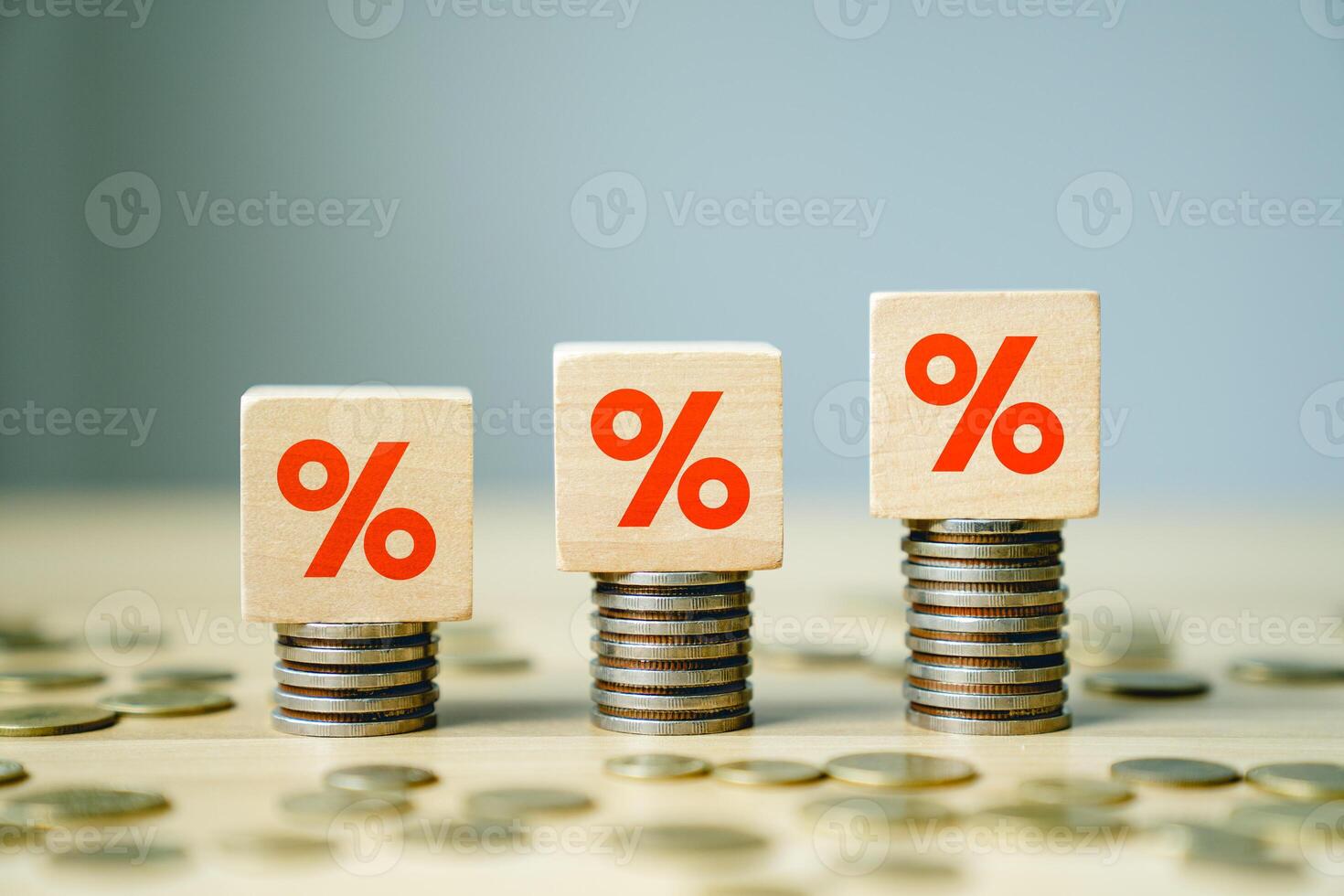 Increasing Interest Rates and Financial Growth Concept with Percent Symbols on Wooden Blocks and Stacks of Coins Representing Economic Changes, Inflation, and Investment Opportunities photo
