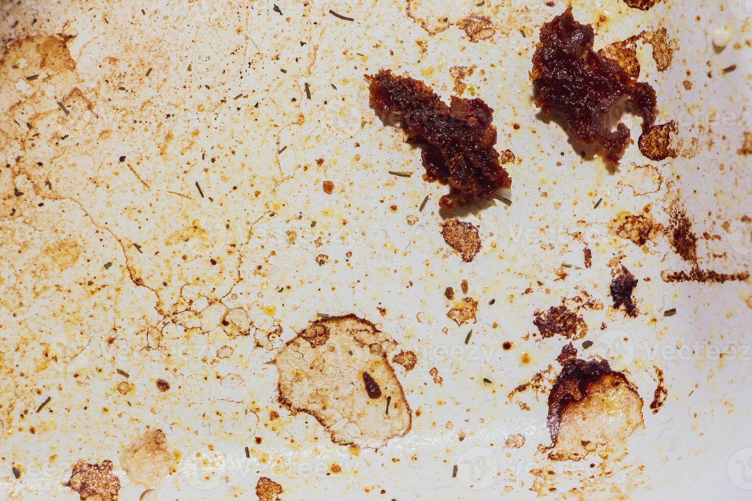 Texture of dirty stains and grease on white stove photo