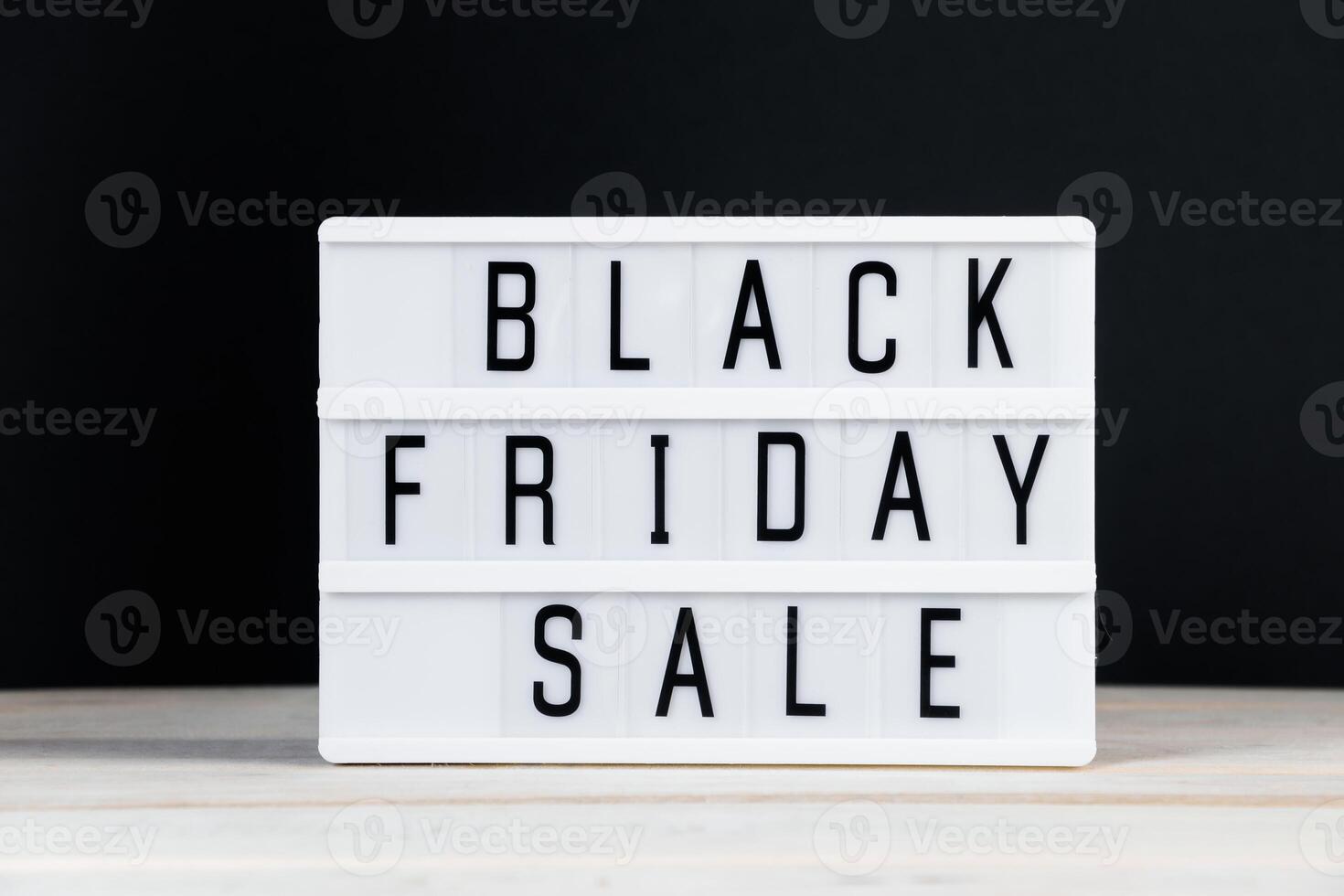 Black Friday concept. Lightbox with text on dark background. photo