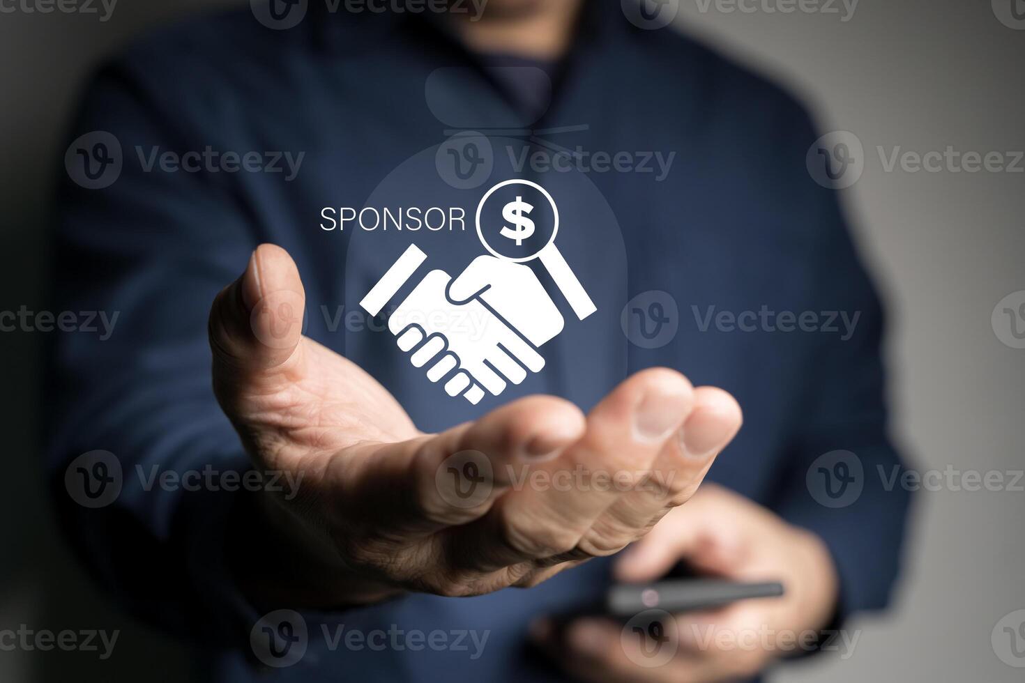 Businessman showing sponsor icon on virtual screen. Sponsorship concept. photo
