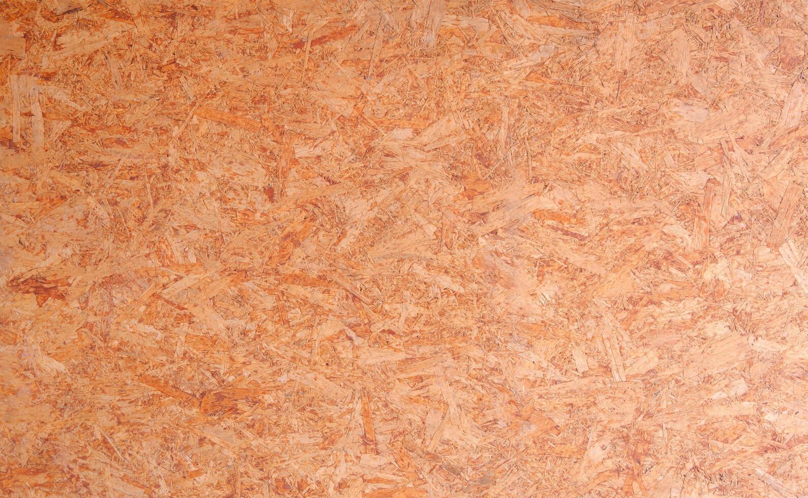Seamless compressed wood particle board texture background. OSB oriented strand wooden board backdrop. photo
