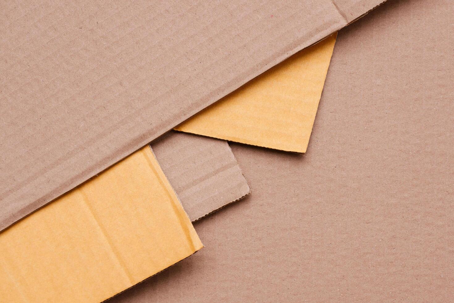 Part of 5 Cardboard paper sheets stacked in geometric pattern background in table top view, Flat lay with copy space photo
