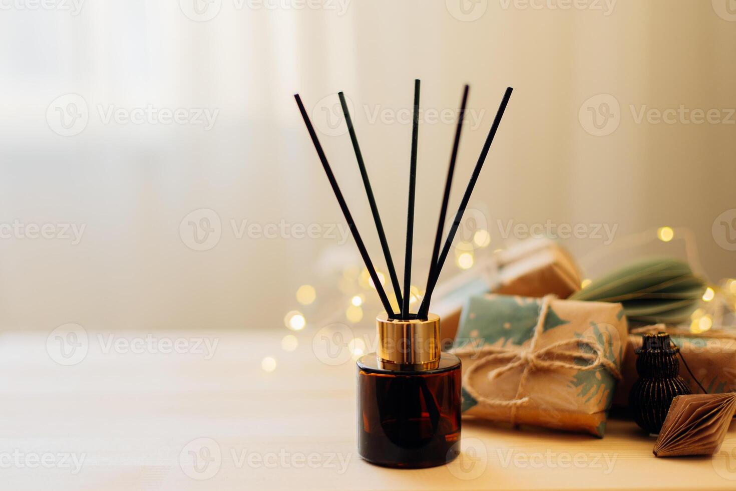 Home winter aroma fragrance diffuser on wooden table. Interior elements. Christmas and Winter decoration. Copy space photo