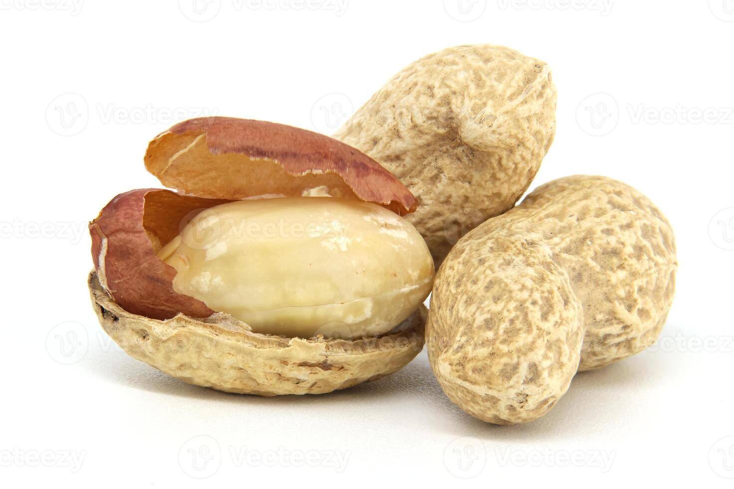 Close-Up of Peanuts in Shell With Brown Skin on Surface Isolated on White Background photo