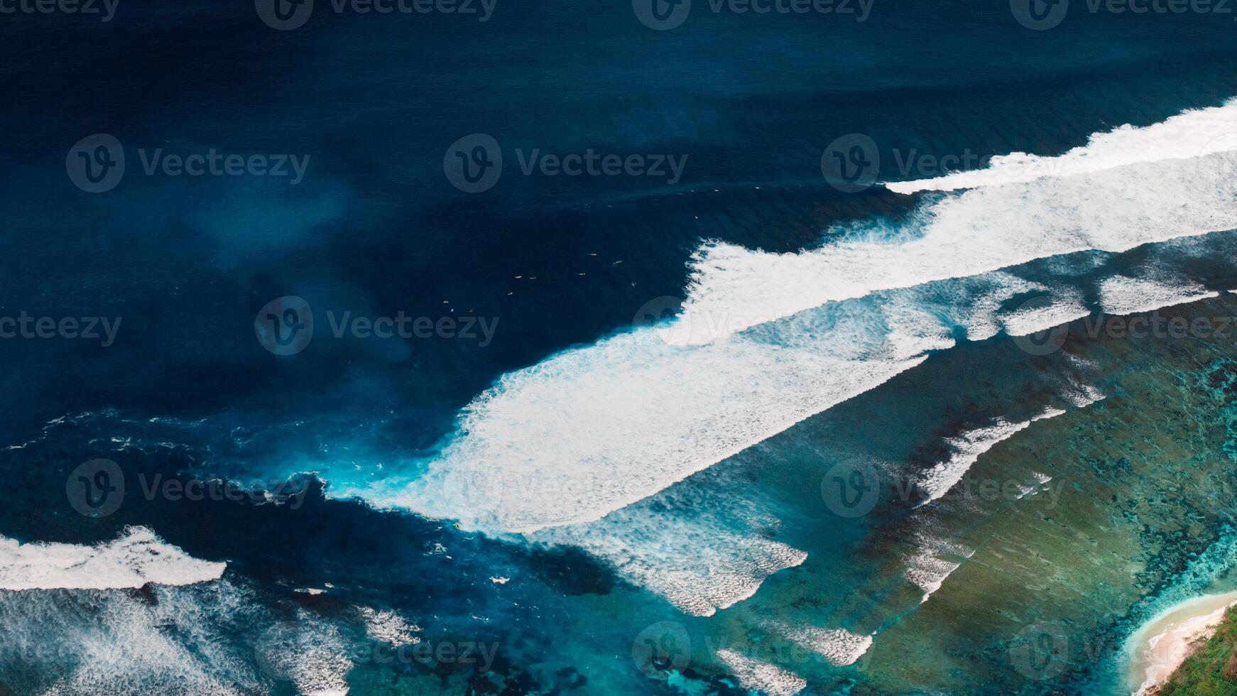 Coastline with stormy ocean waves and current canal and Green bowl beach, drone view photo