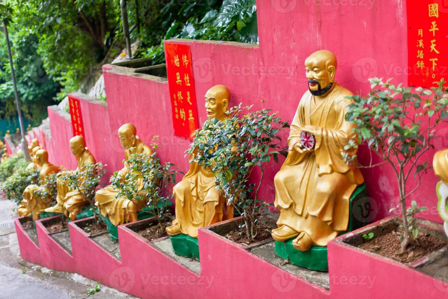Golden statues in The monastery in Hong Kong photo