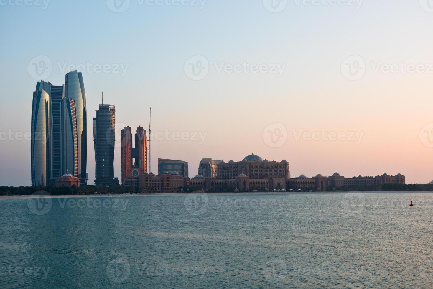 Abu Dhabi buildings skyline from the sea photo