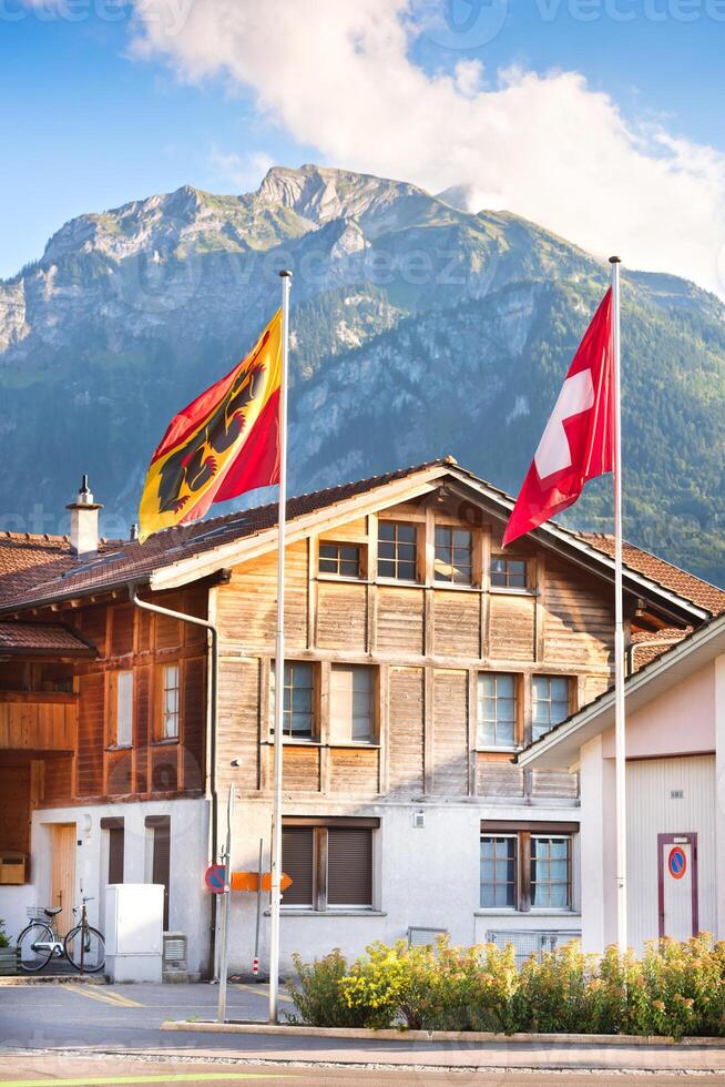 Fluttering Swiss and Bernese Oberland region flags photo