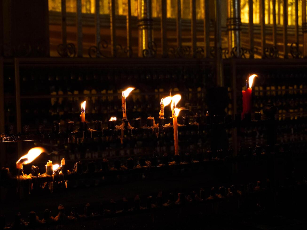 Candles lit on a vintage candlestick on a dark background. photo
