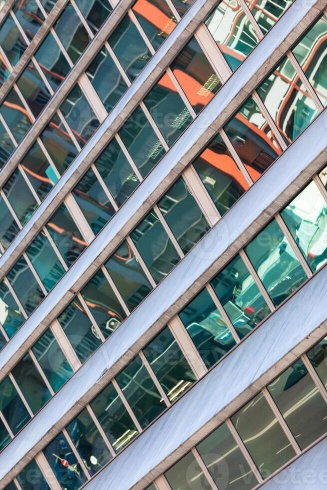 Glass Building Facade with Street Reflections photo