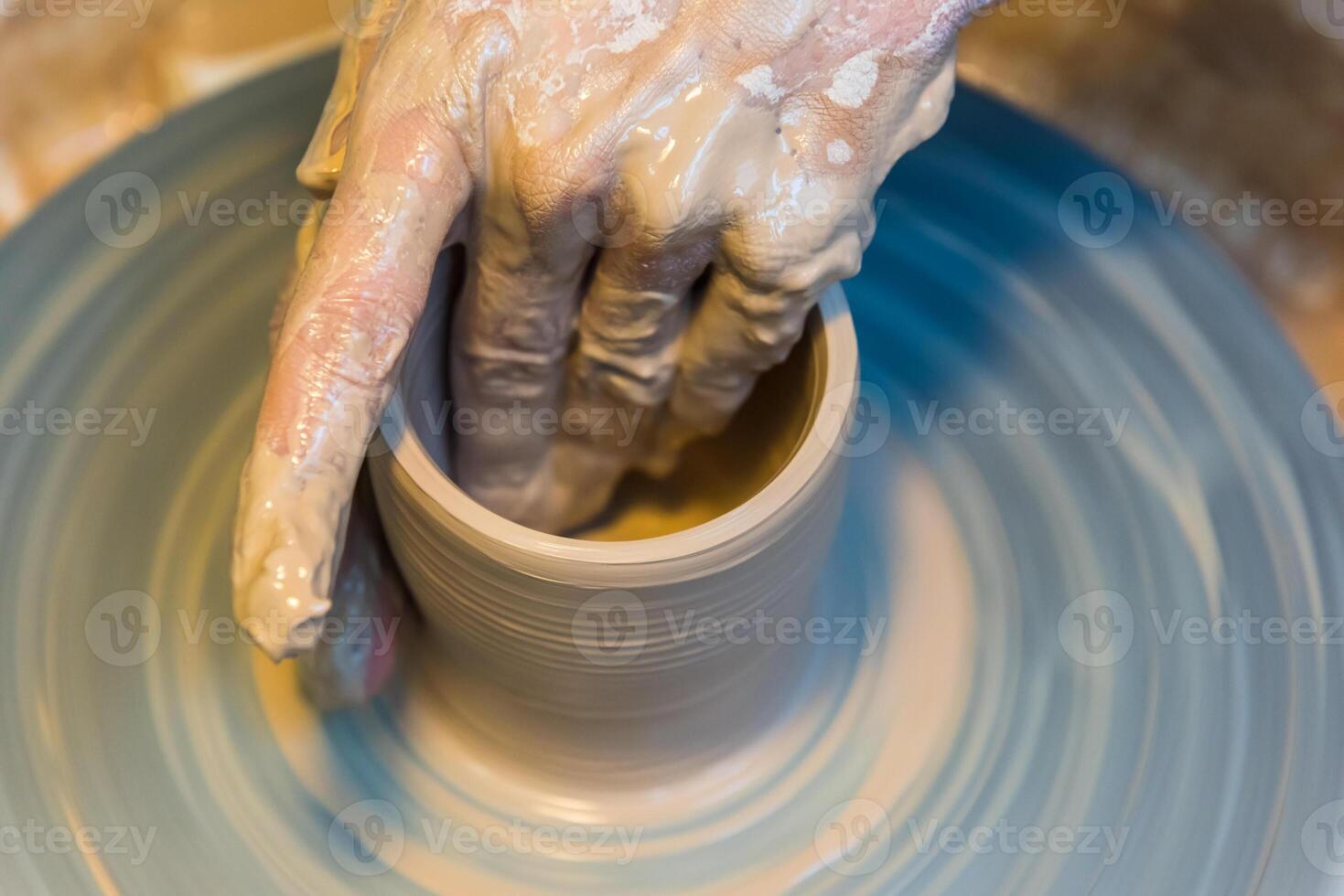 Pottering - creating a clay cup in process photo