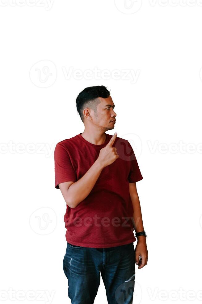 Side view portrait of a man in a red t-shirt pointing to his right with a serious expression photo