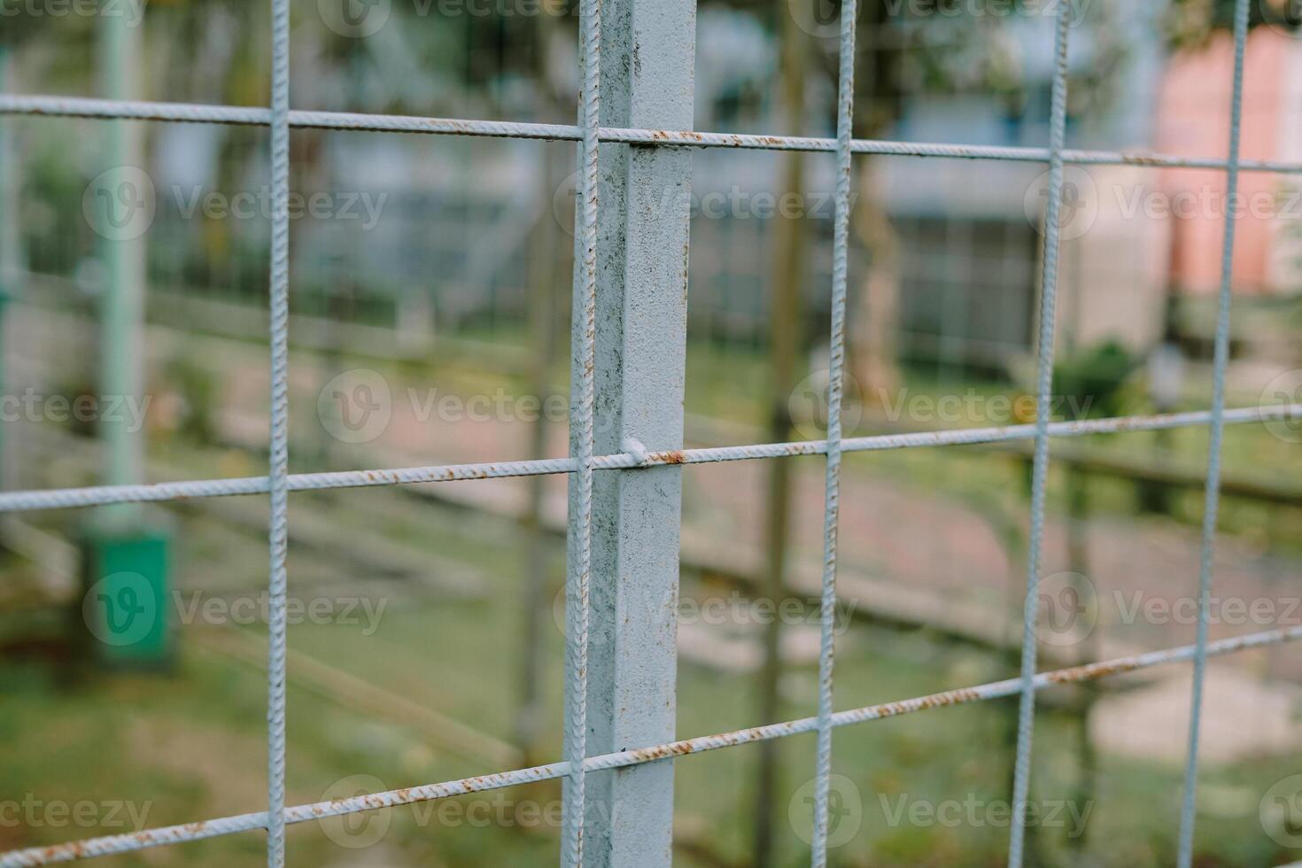 greenhouse structure with rusted metal frames and green walls photo
