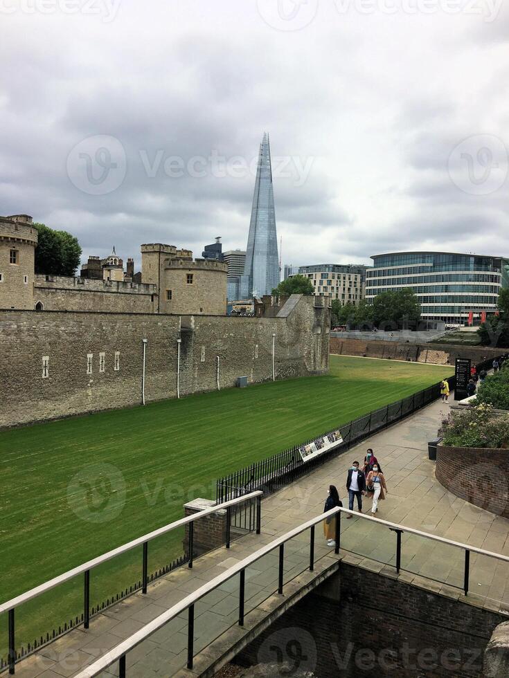 A large grassy area with a building in the background photo
