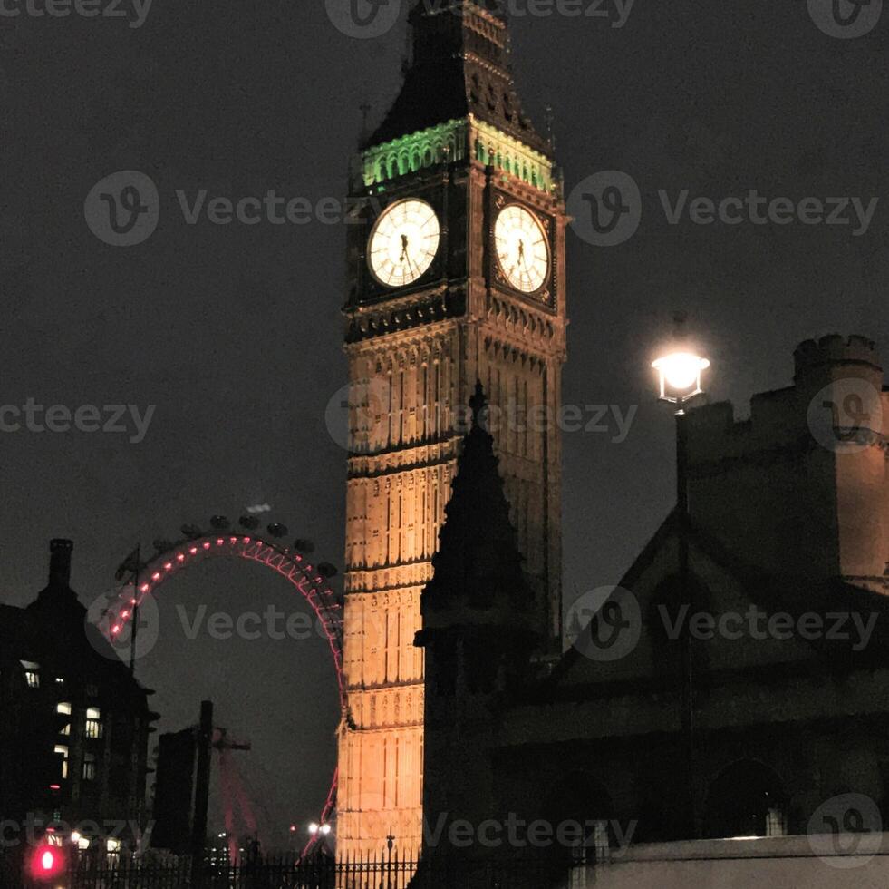 A large clock tower with a clock on it photo