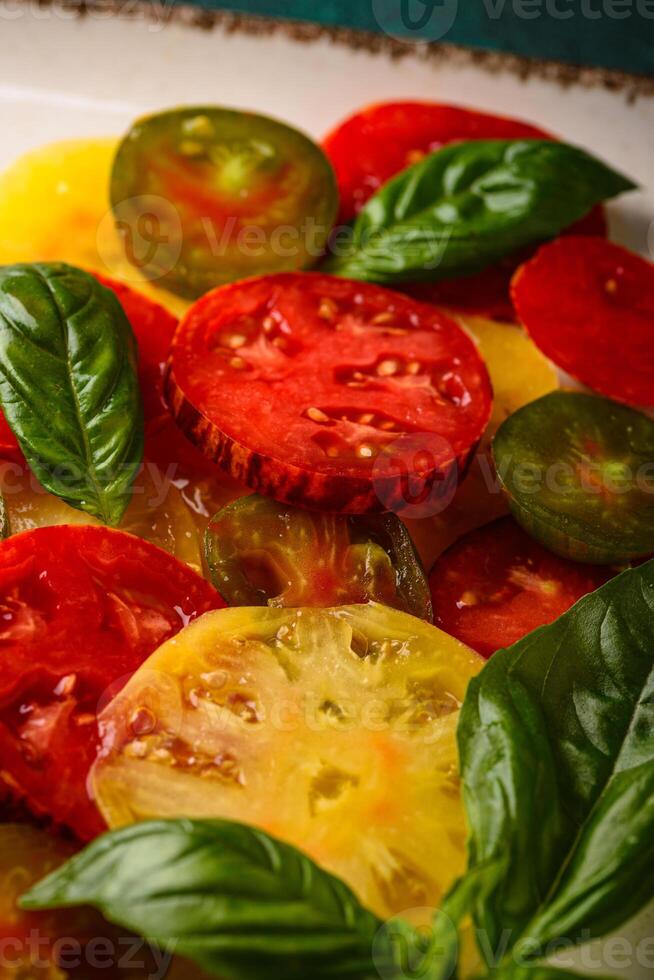 Different sort of sliced ripe tomatoes photo