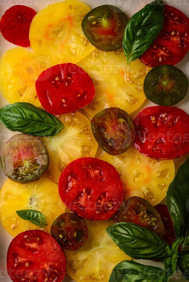 Different sort of sliced ripe tomatoes photo