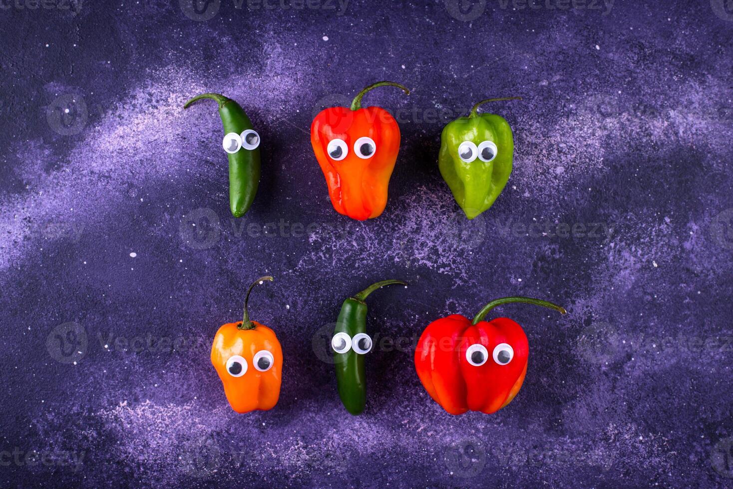 Cute color bell pepper with eyes. photo