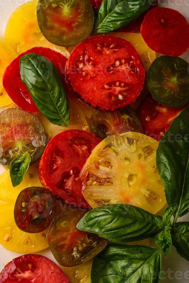 Different sort of sliced ripe tomatoes photo
