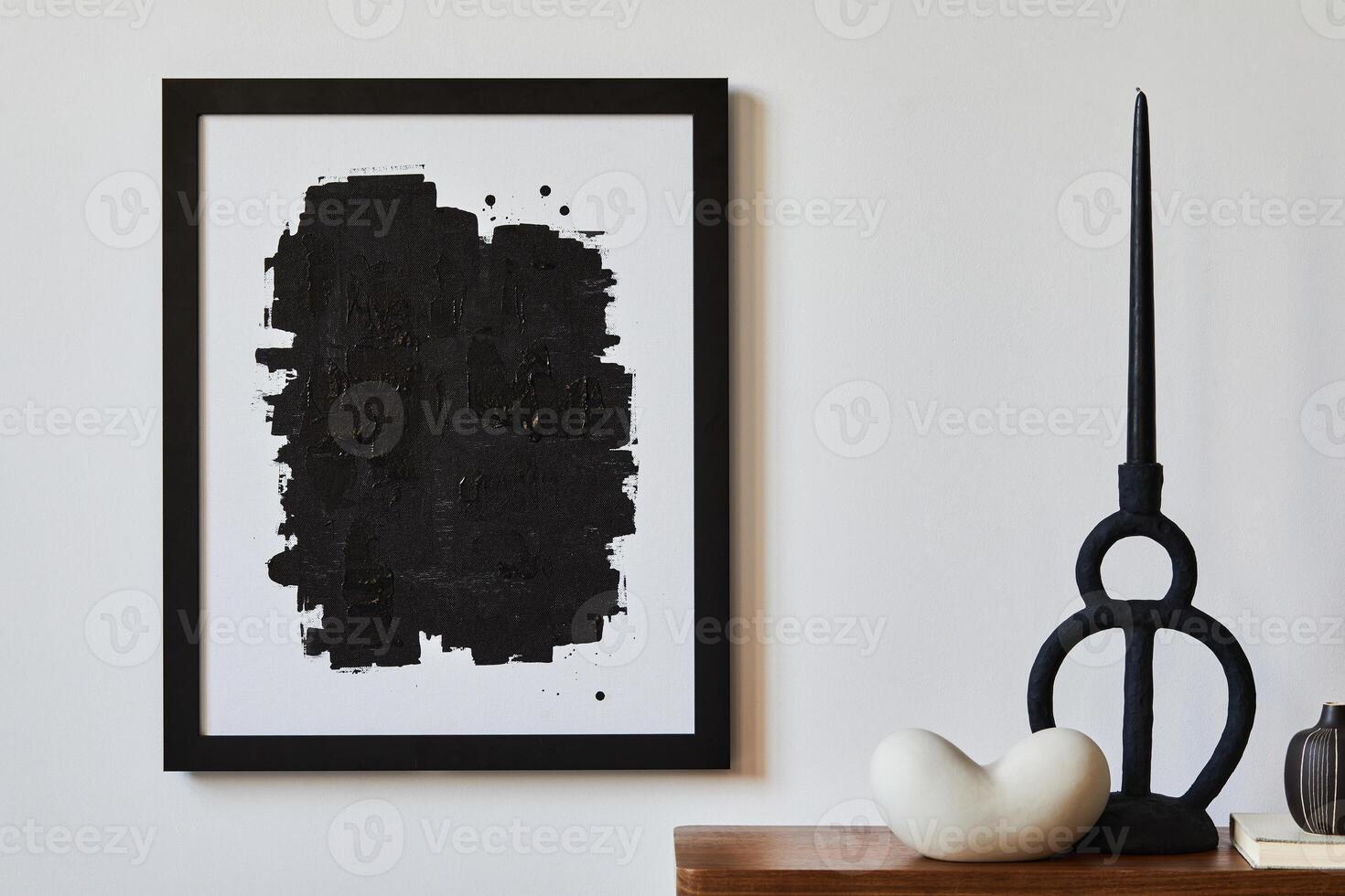 Creative composition of minimalist living room with mock up poster frame, wooden commode, candlestick and personal accessories. Copy space. Template. photo