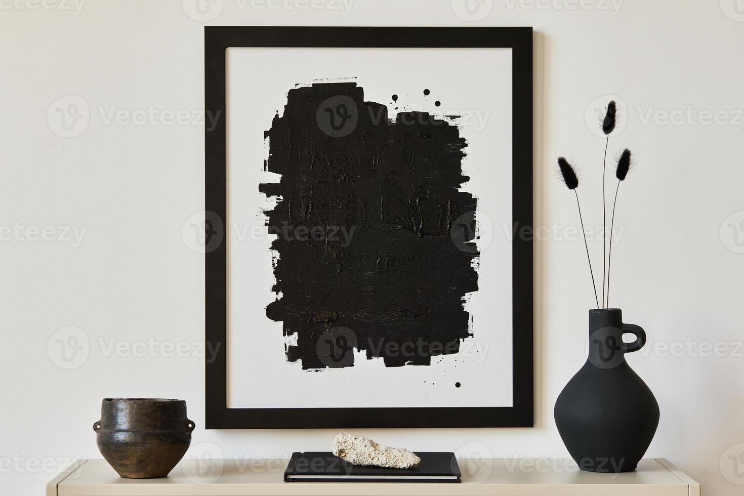 Elegant minimalist interior design with black mock up poster frame, metal shelf and minimalistic accessories and vase. BLakc and white concept. Copy space. Template. photo