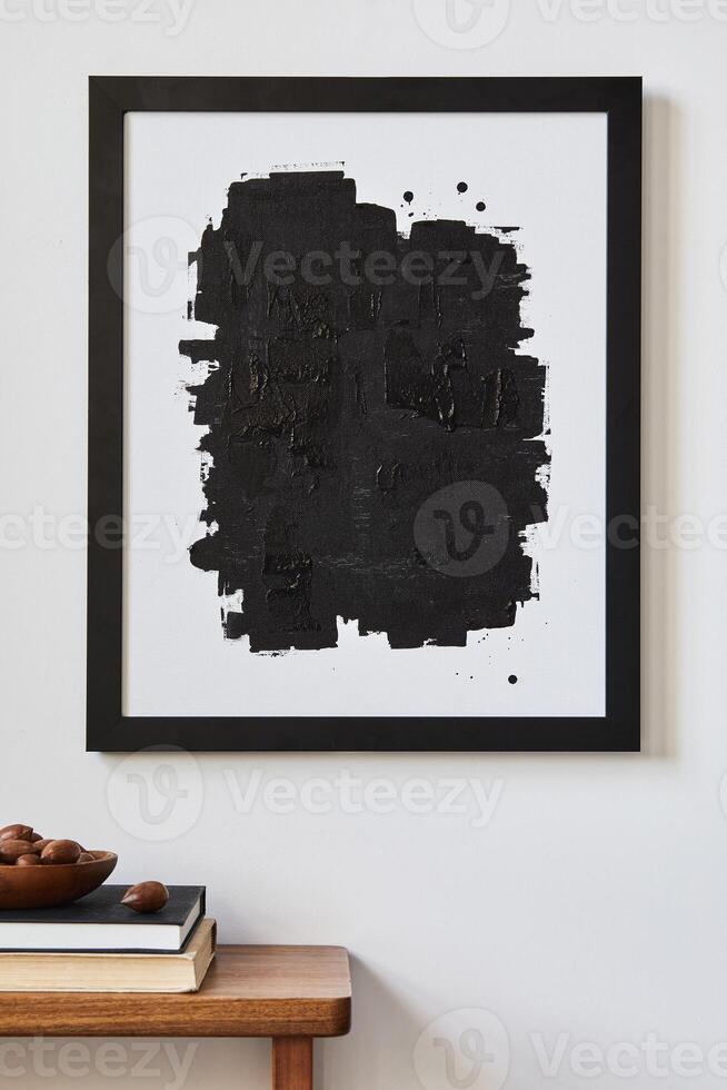 Minimalist composition of living room interior with mock up poster frame, wooden commode and personal accessories. Copy space. Template. photo