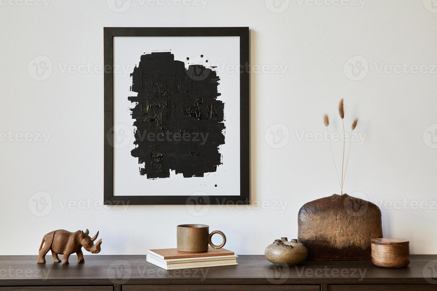 Minimalistic composition of creative living room interior with mock up poster frame and stylish small personal accessories on wooden commode. Copy space. Template. Real photo. photo