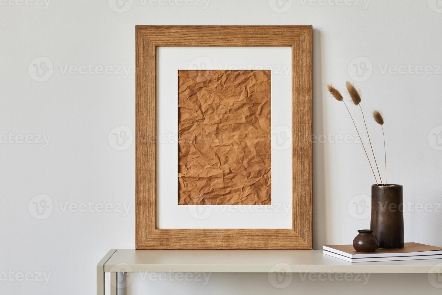 Minimalist composition of living room interior with mock up poster frame, beige commode, retro vase and personal accessories. Copy space. Template. photo