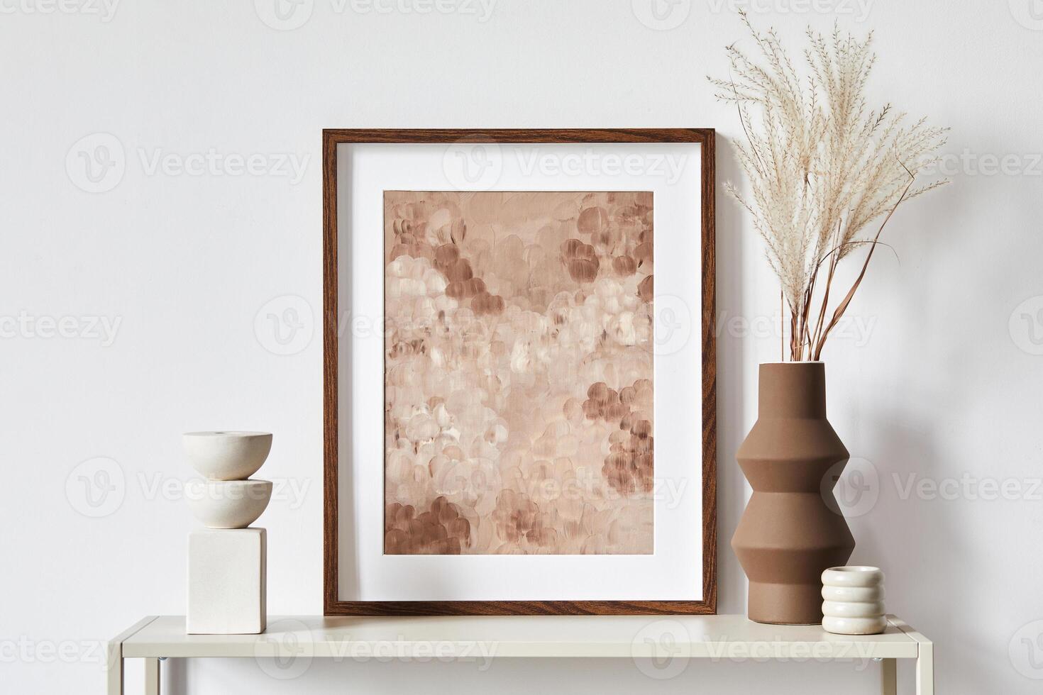 Minimalist composition of living room interior with mock up poster frame, white commode, vase and personal accessories. Copy space. Template. photo