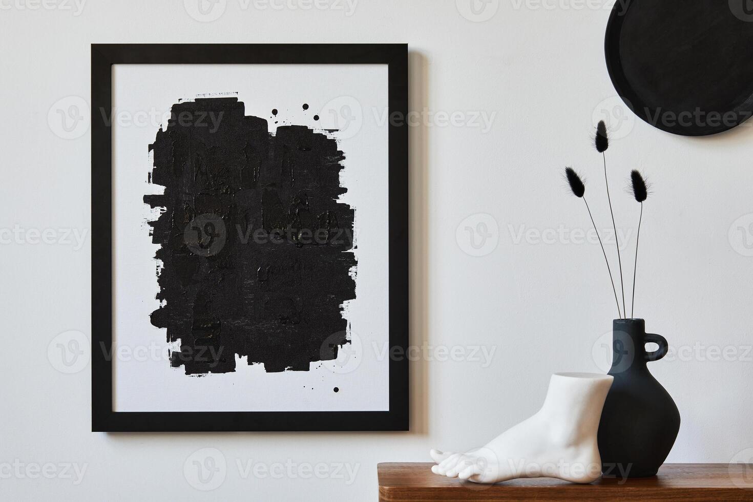 Creative composition of minimalist living room with mock up poster frame, wooden commode, vase and personal accessories. Copy space. Template. photo