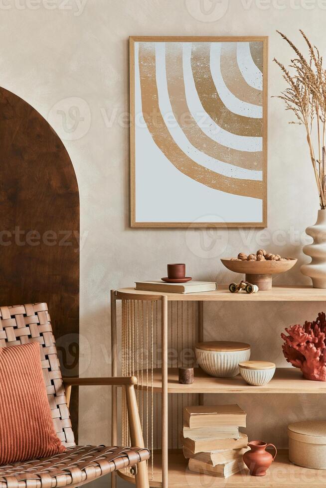 Creative living room interior design with console, armchair, mock up poster frame, vase and elegant personal accessories. Copy space. . photo