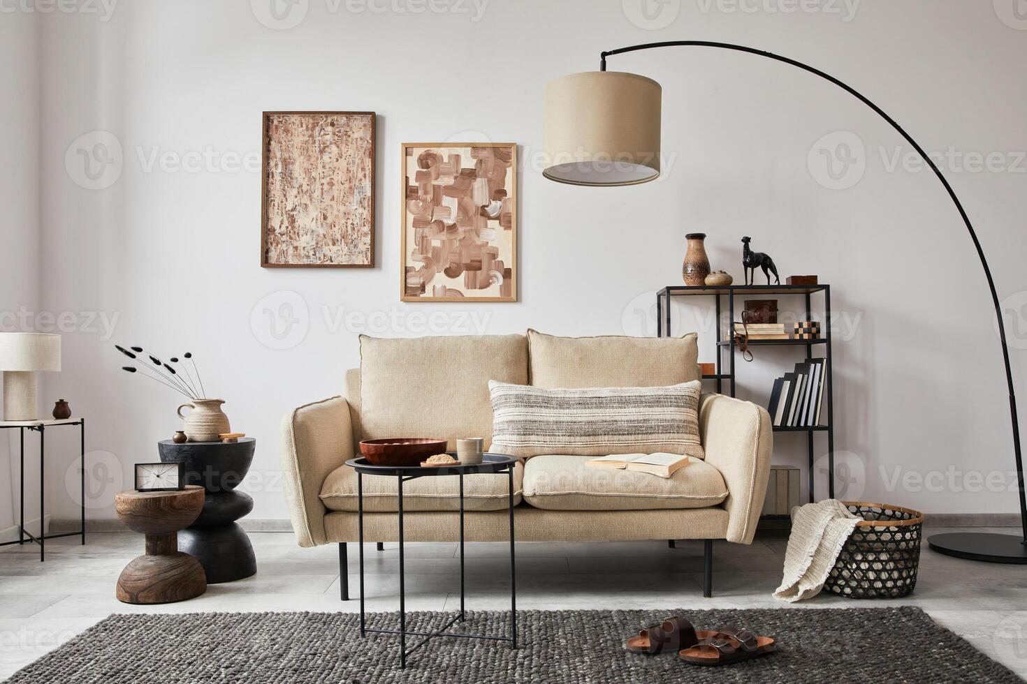 Creative composition of modern living room interior with mock up poster frames, beige sofa, side table and stylish small personal accessories on metal shelf. Copy space. Template. photo