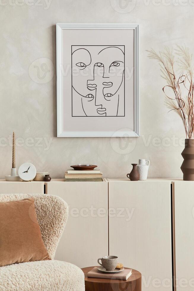 Stylish composition of creative interior design of living room with mock up poster frame, fluffy armchair , commode and personal accessories. Modern style. Template. photo