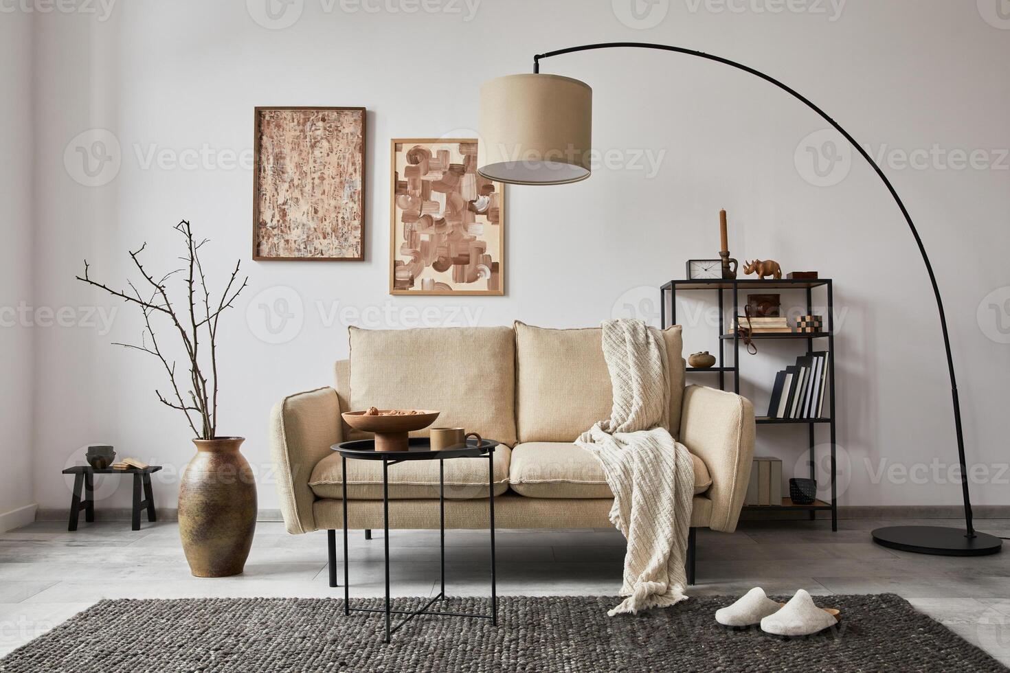 Stylish composition of elegant living room interior design with mock up poster frames, metal and wooden shelf, sofa, vintage vases and personal accessories. White wall. Copy space. Template. photo