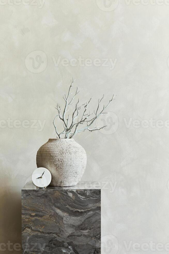 Elegant interior composition with marble cube coffee table and stylish personal accessories and vase. Copy space. Template. photo