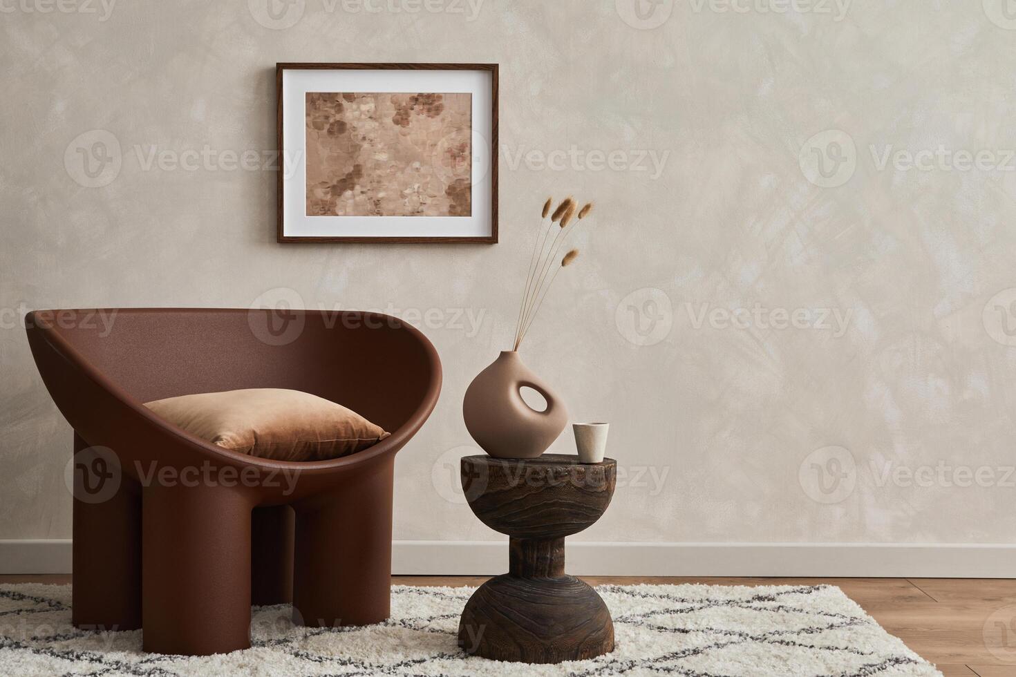 Minimalistic composition of elegnat living room with creative armchair, mock up poster frame, coffee table and stylish personal accessories. Copy space. Template. photo