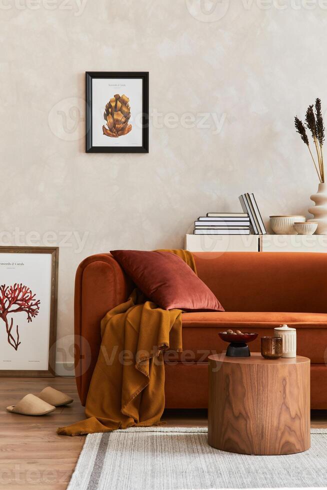 Creative interior composition of living room with mock up poster frames, designed couch, coffee table, and personal accessoriers. photo