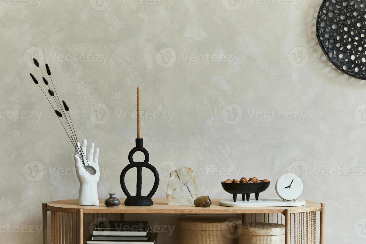 Stylish composition of personal accessories on the console in the living room. Sculpture, candlectick, minerals and tray. Copy space photo