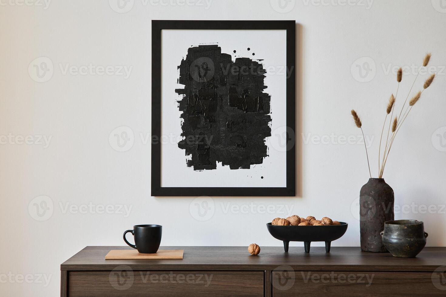 Minimalistic composition of creative living room interior with mock up poster frame and stylish small personal accessories on wooden commode. Copy space. Template photo