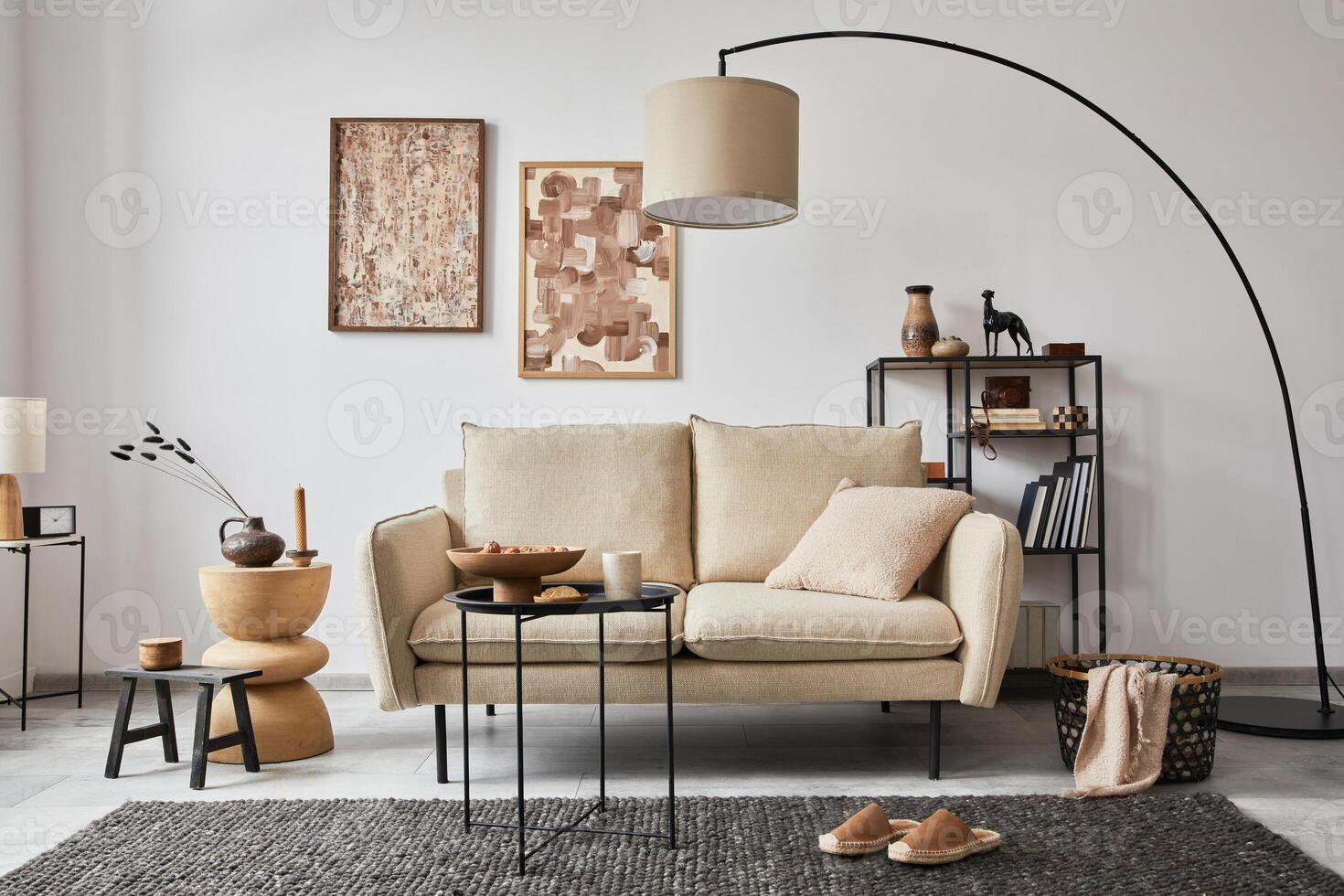 Stylish composition of elegant living room interior design with mock up poster frames, metal and wooden shelf, sofa, lamp and personal accessories. White wall. Copy space. Template. photo