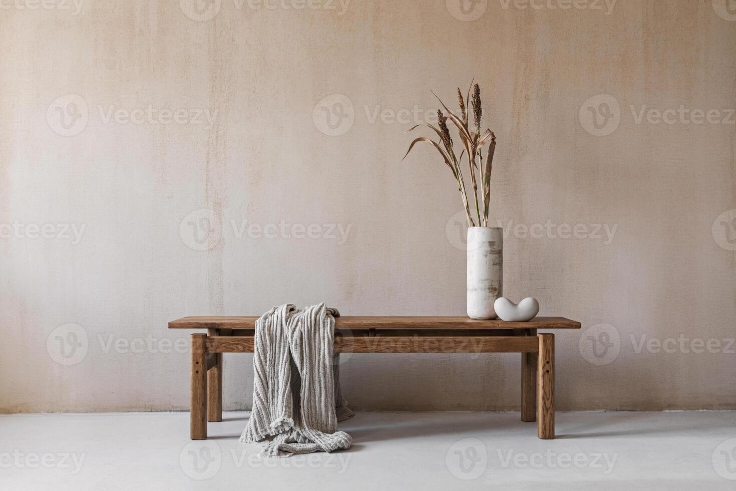 Creative composition with elegant wooden bench. Beautiful decorations and accessories. Modern home interior design. Retro inspiration. Copy space. Structure wall. Template photo