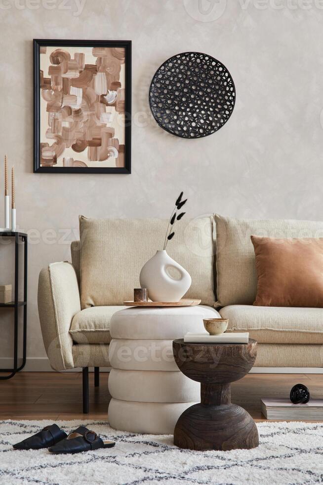 Elegant living room interior composition with beige sofa, black console, coffee table, pouf, mock up poster frame and creative design personal accessories. Copy space. Template. photo
