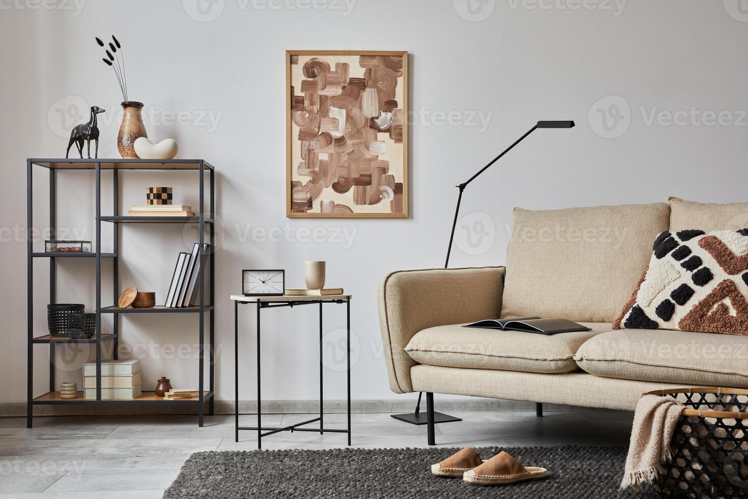 Creative composition of modern living room interior with mock up poster frame, beige sofa, side table, metal shelf and stylish small personal accessories on metal shelf. Copy space. Template. photo