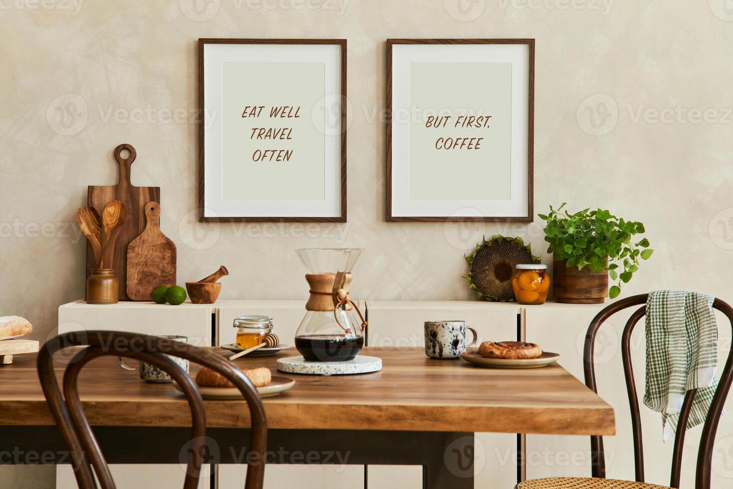 Elegant composition of stylish dining room intrerior with mock up poster frames, beige sideboard, family dining table, plants and vintage personal accessories. Copy space. Template. Autumn vibes. photo