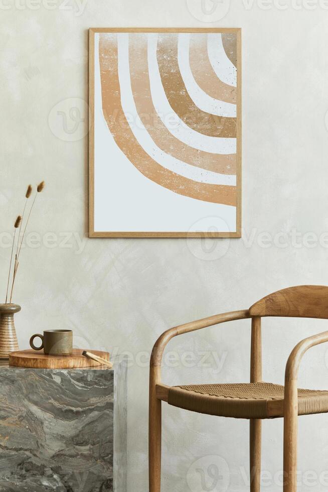 Stylish wabi-sabi dining room interior design with mock up poster frame, marble cube coffee table, armchair and bautiful personal accessories. Modern home decor. Template. photo