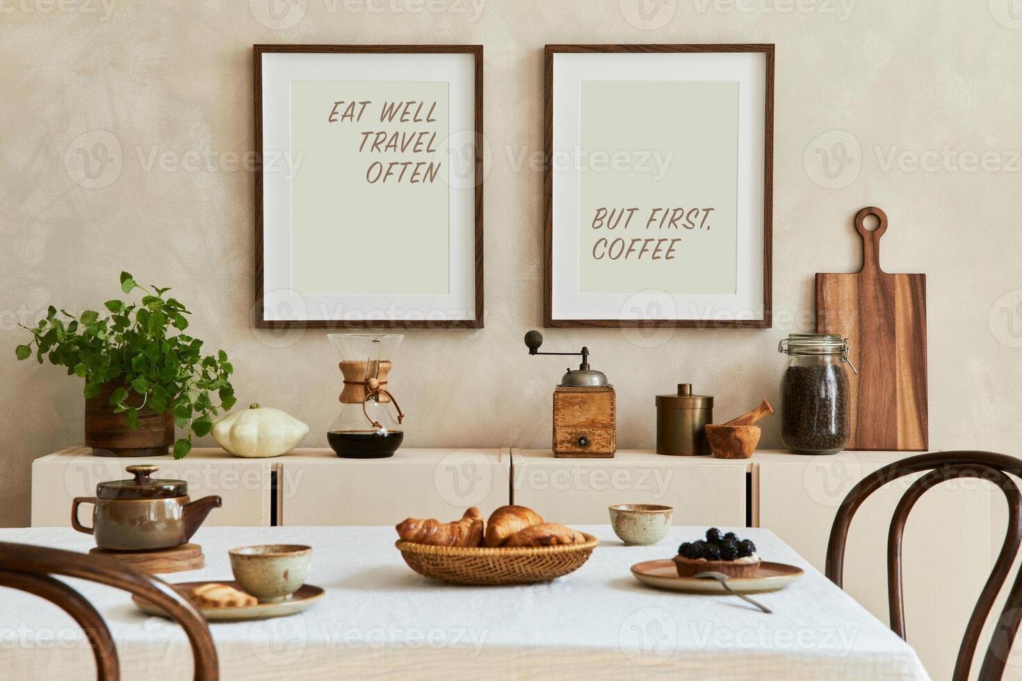 Elegant composition of stylish dining room intrerior with mock up poster frames, beige sideboard, family dining table, plants and vintage personal accessories. Copy space. . Autumn vibes. photo