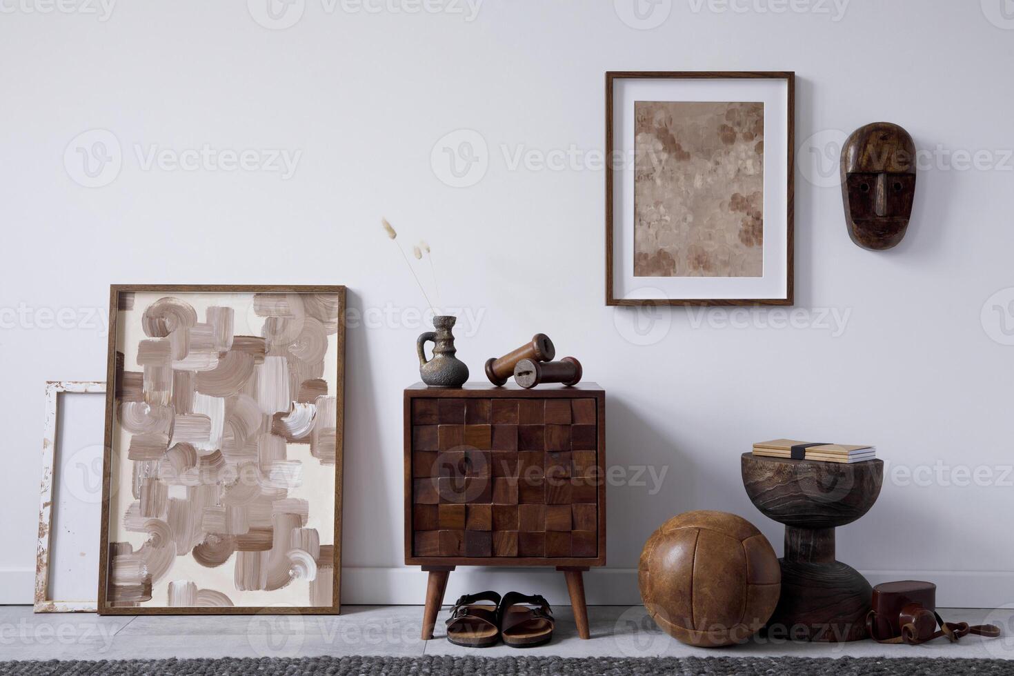 Stylish living room interior design with small wooden commode, mock up poster frame and creative accessories and home decor. Modern home staging. Template. Copy space. photo